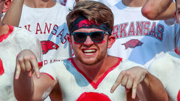 Razorback fans giving 'Horns Down' gesture against Texas in 2021